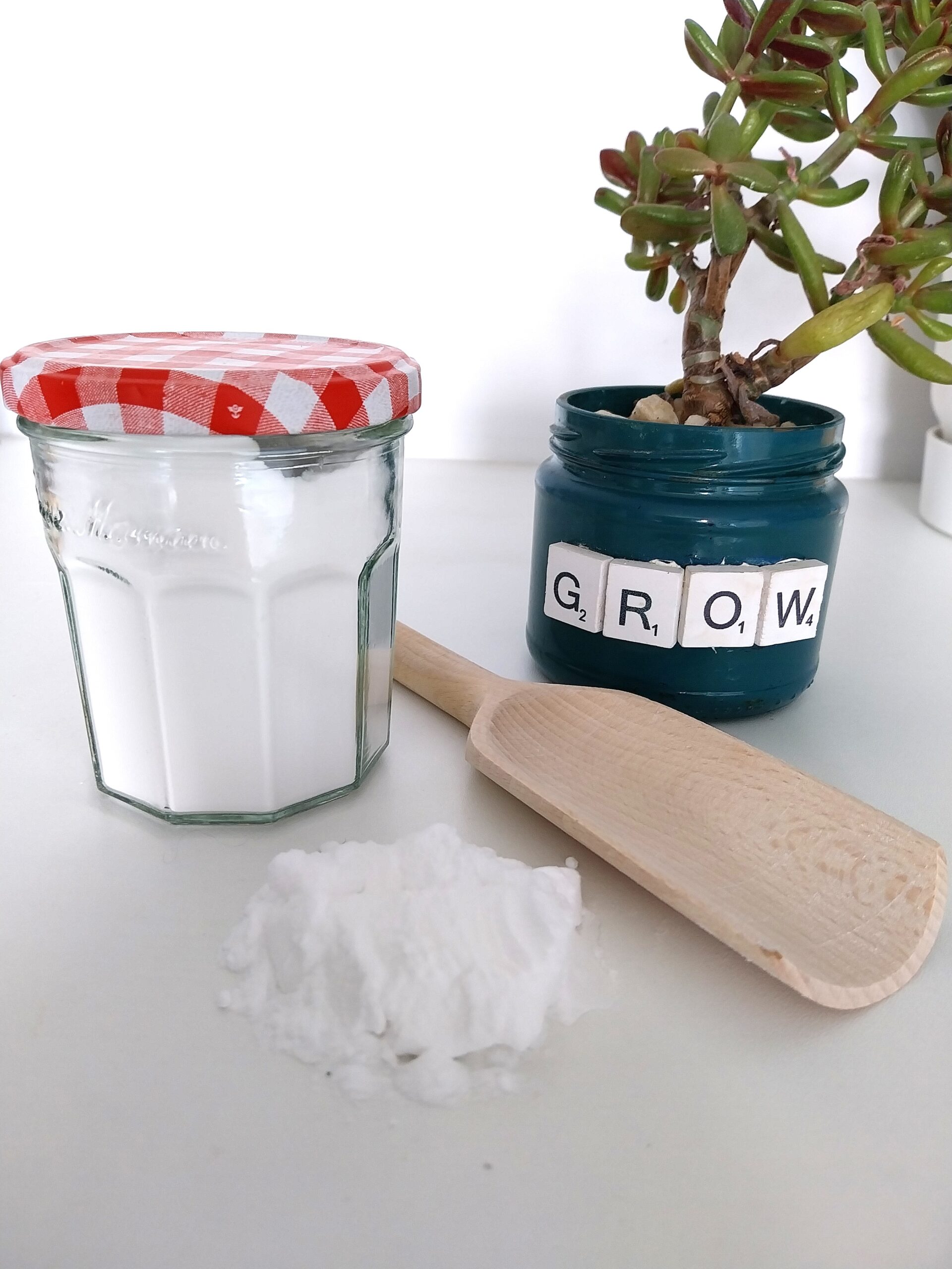 bicarbonate of soda bicarbonate of soda loose next to a preloved glass jar filled with bicarbonate of soda